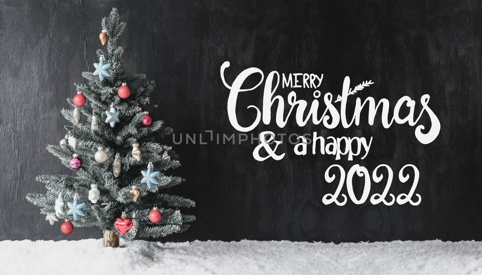 English Calligraphy Merry Christmas And A Happy 2022. Tree With Colorful Ball Ornament And Snow