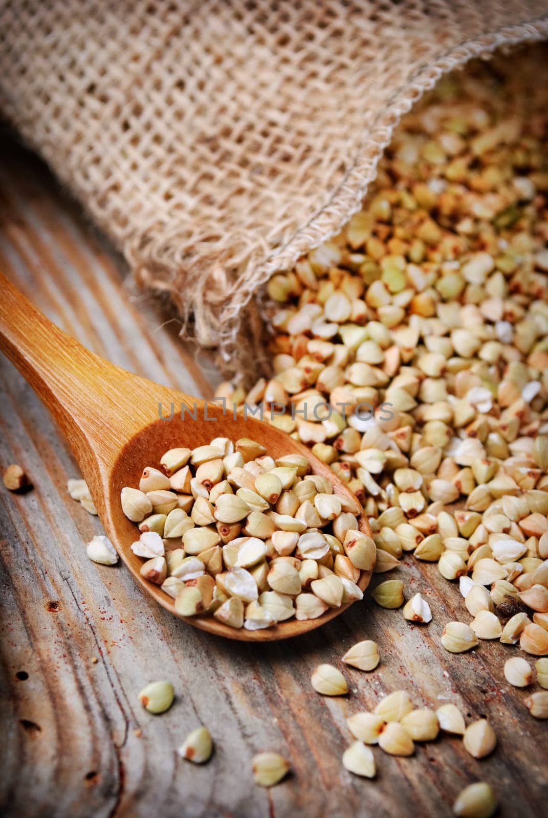 Closeup of buckweat in wooden spoon
