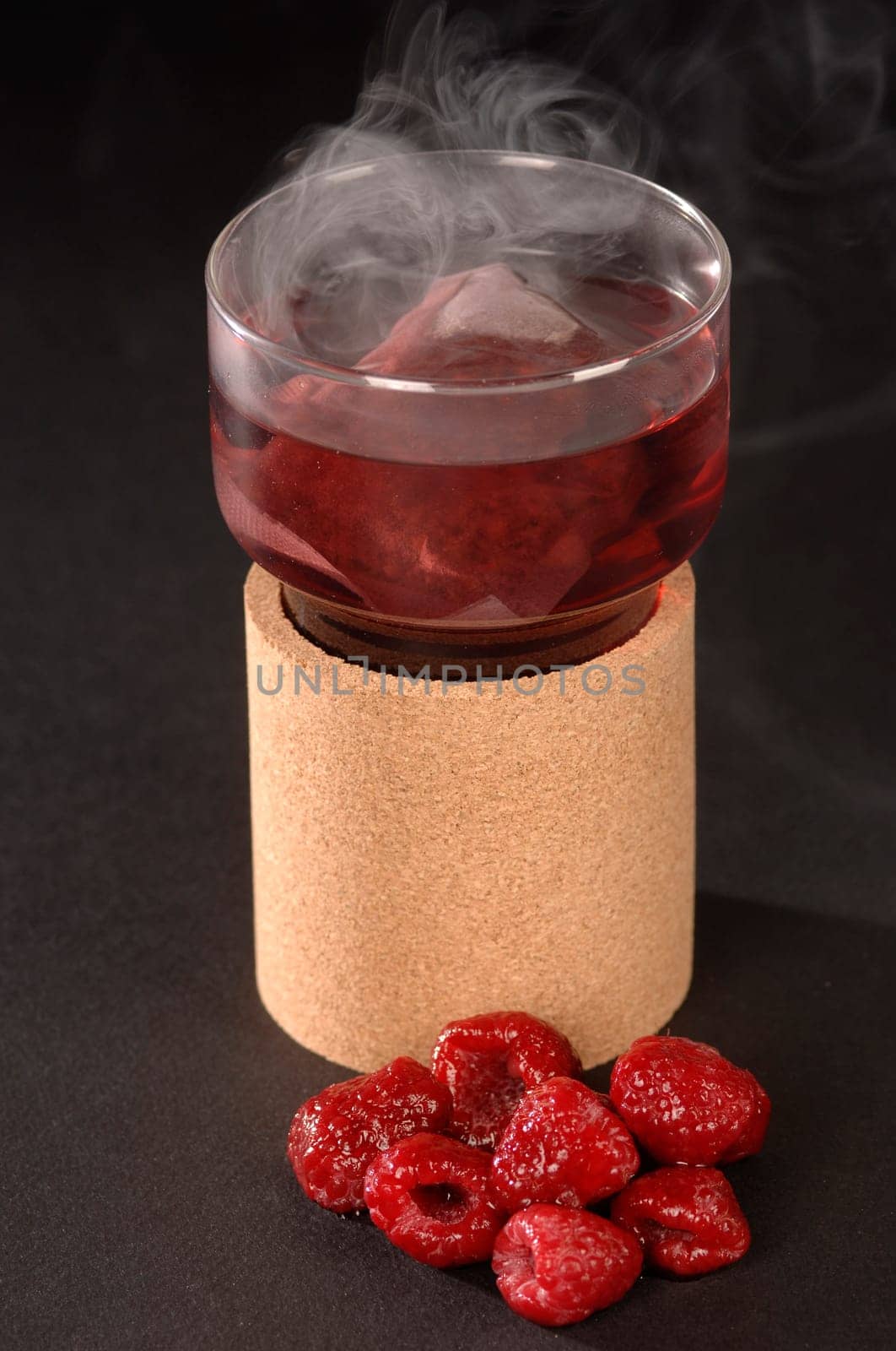hot herbal tea in a glass ,raspberry