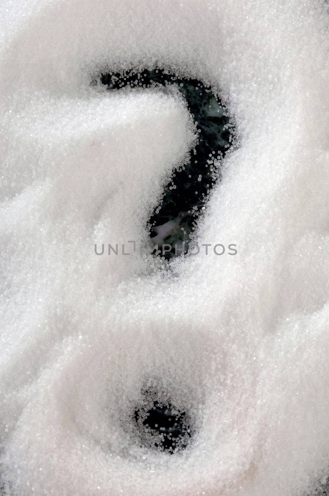 white crystalline salt on a dark background