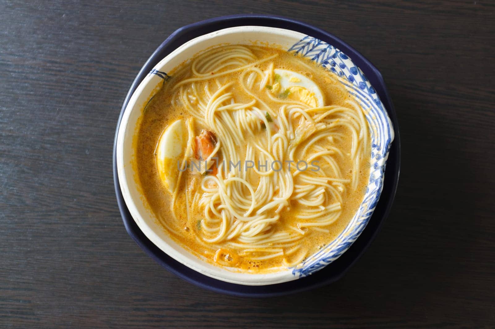 Asian noodle soup, ramen with prawn shrimp and egg