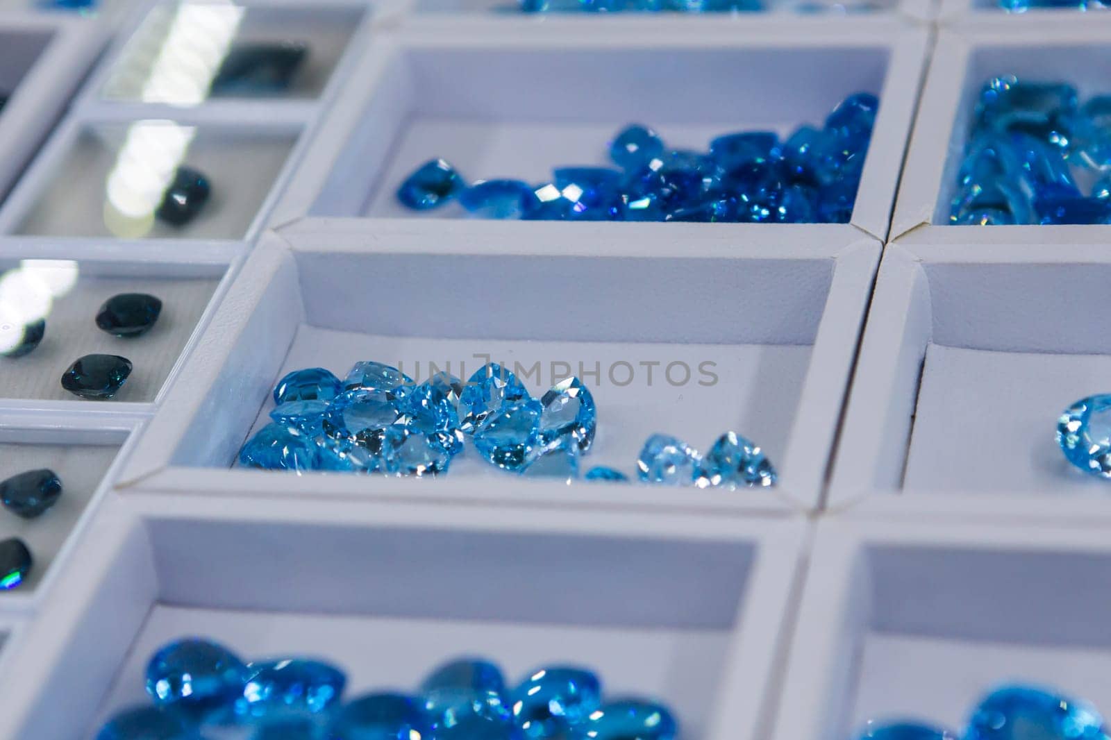 Artificial jewelry stones in the jewelry store window.