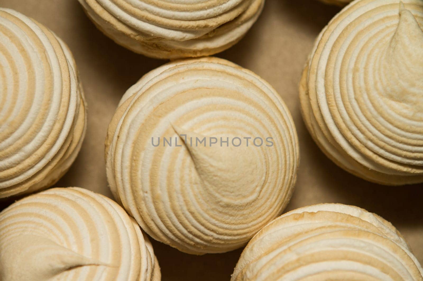 Sweet vanilla marshmallows on brown kraft paper. Meringue dessert