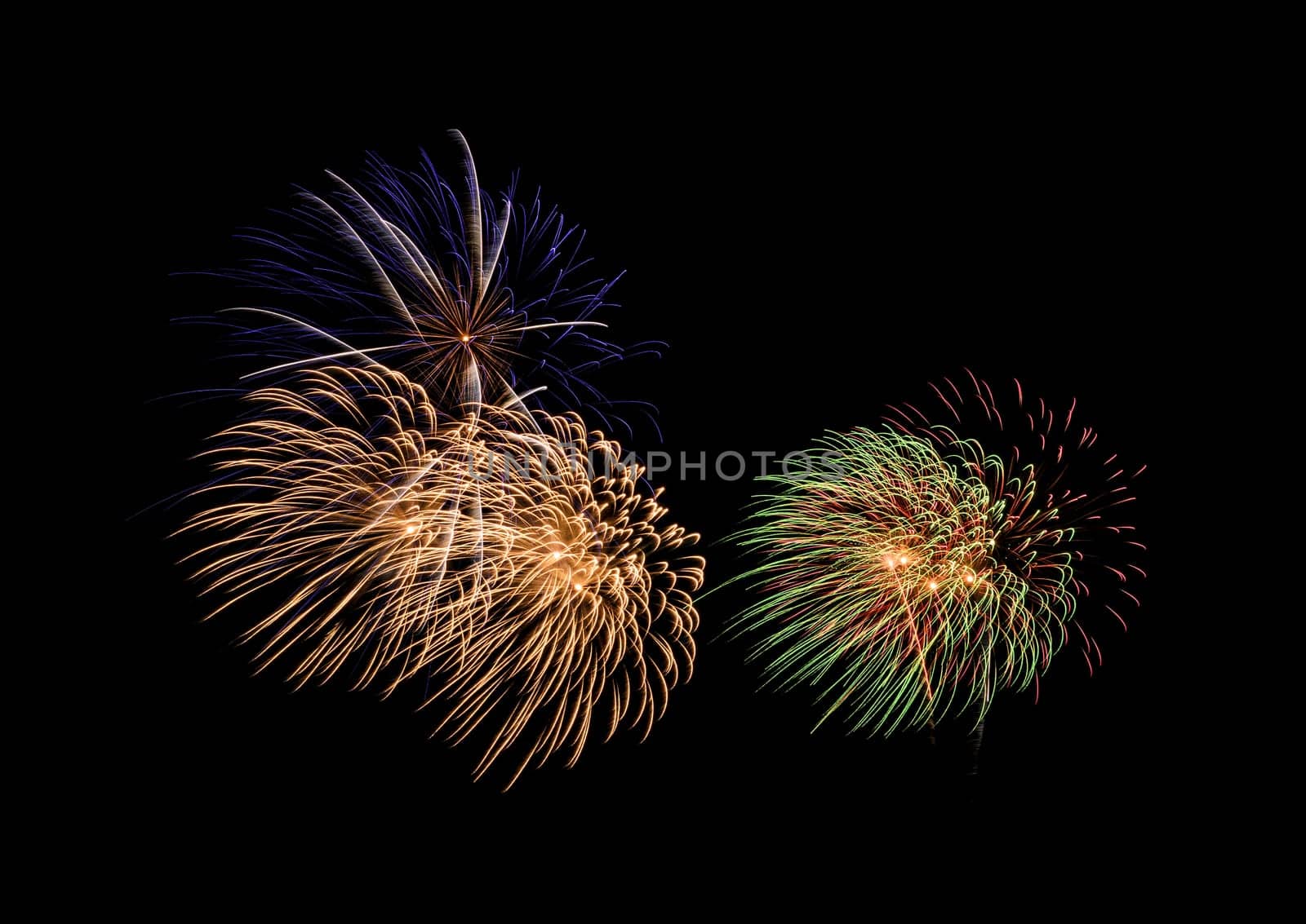 Colorful exploded fireworks display, isolated on black background