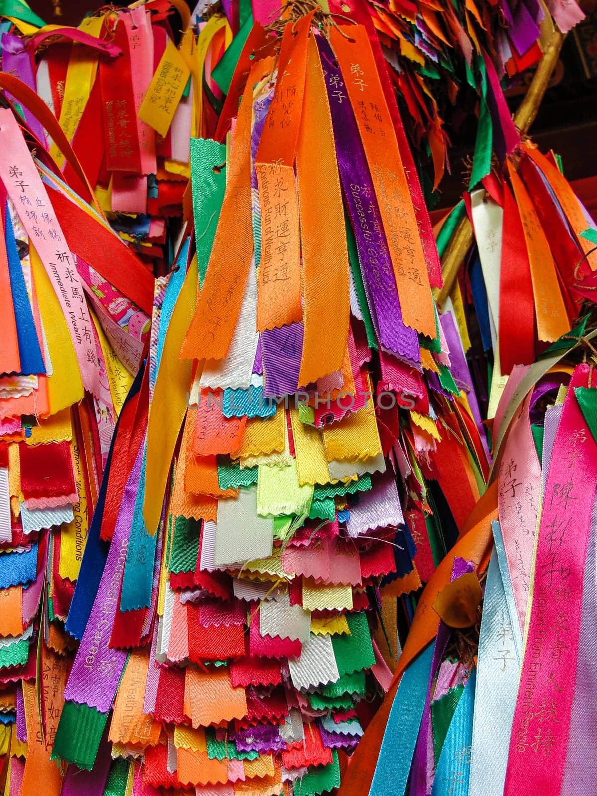 Many colorful ribbons with wishes hangs in the temple. Georgetown, Penang, Malaysia, colorful background