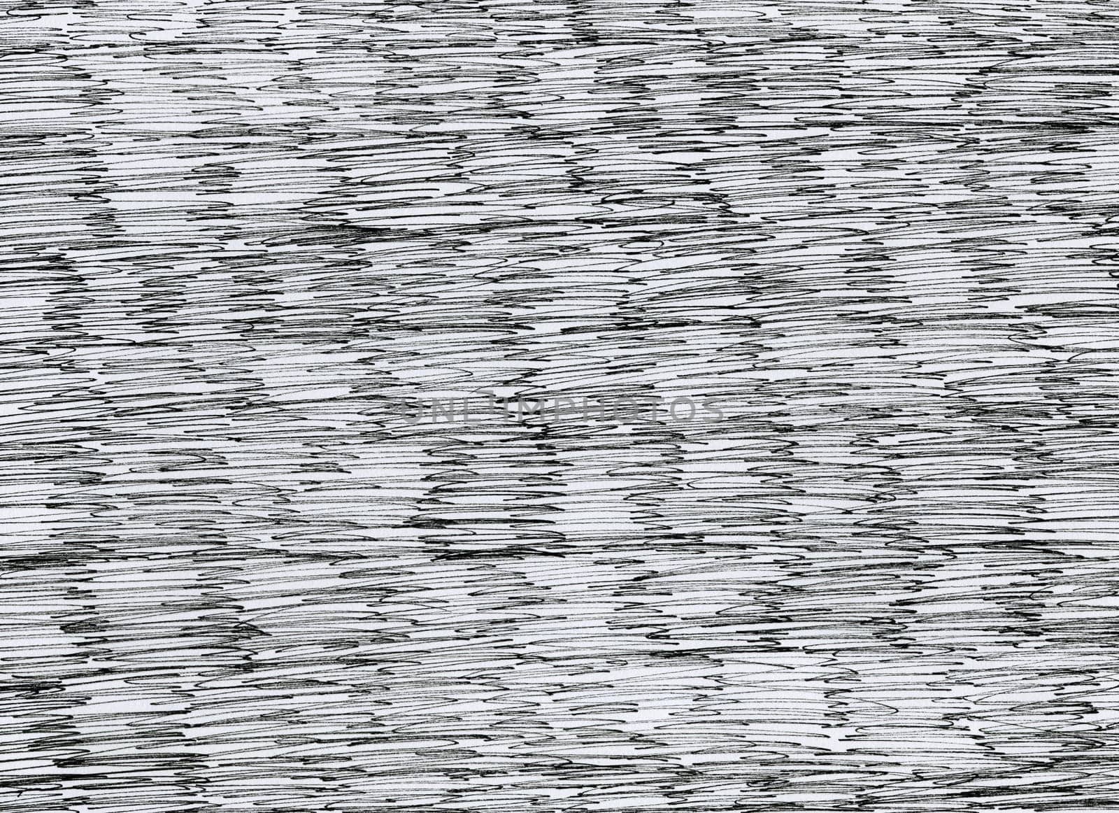 closeup of black liner pencil horizontal doodles brushes on white background