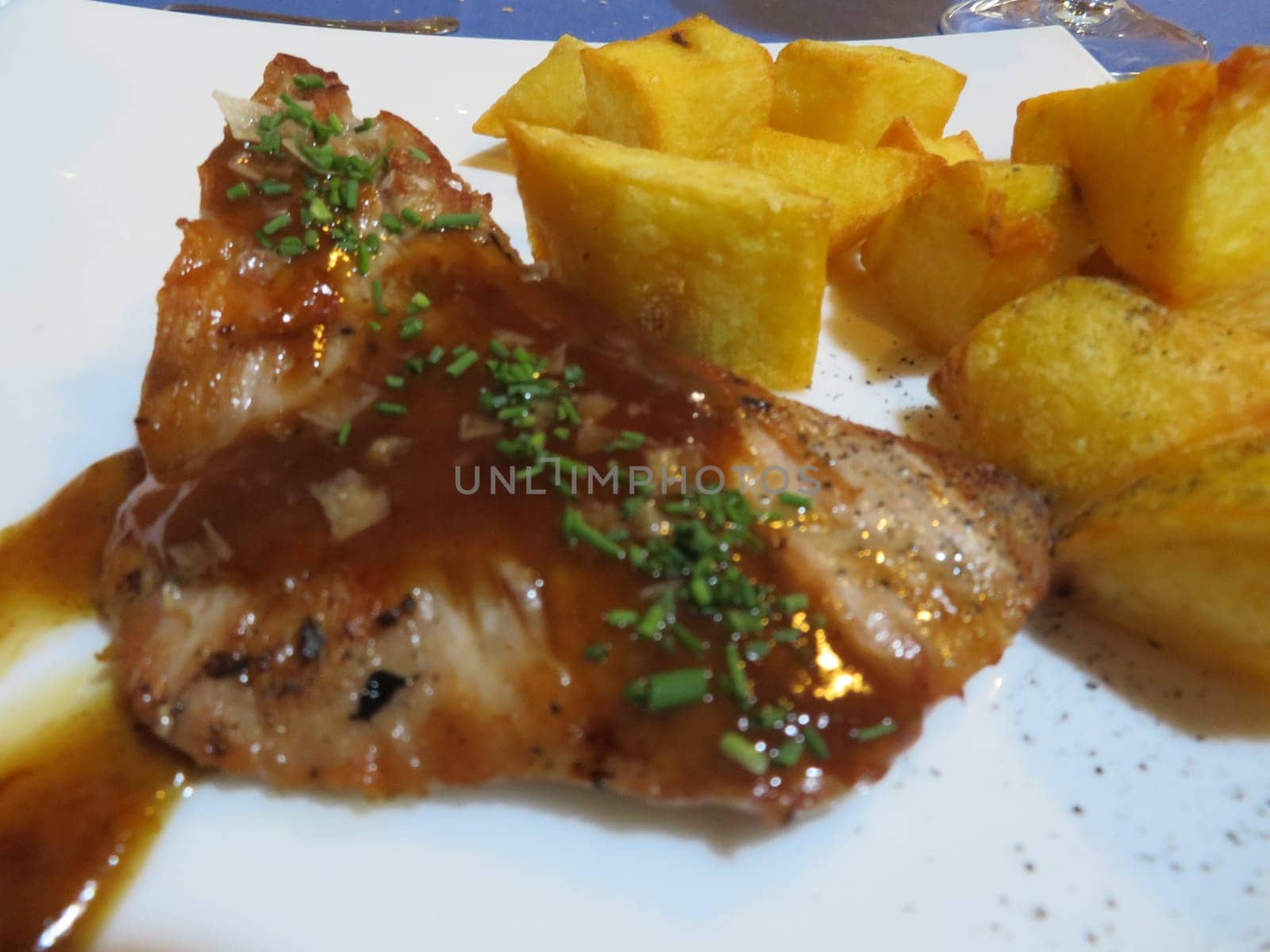 delicious Iberian secret with fries in port sauce luxury food
