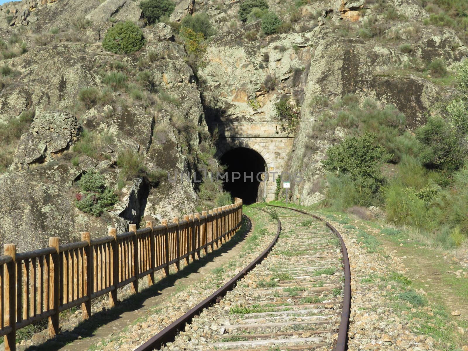 iron road bridges metal rail light at the end of the tunnel train transport