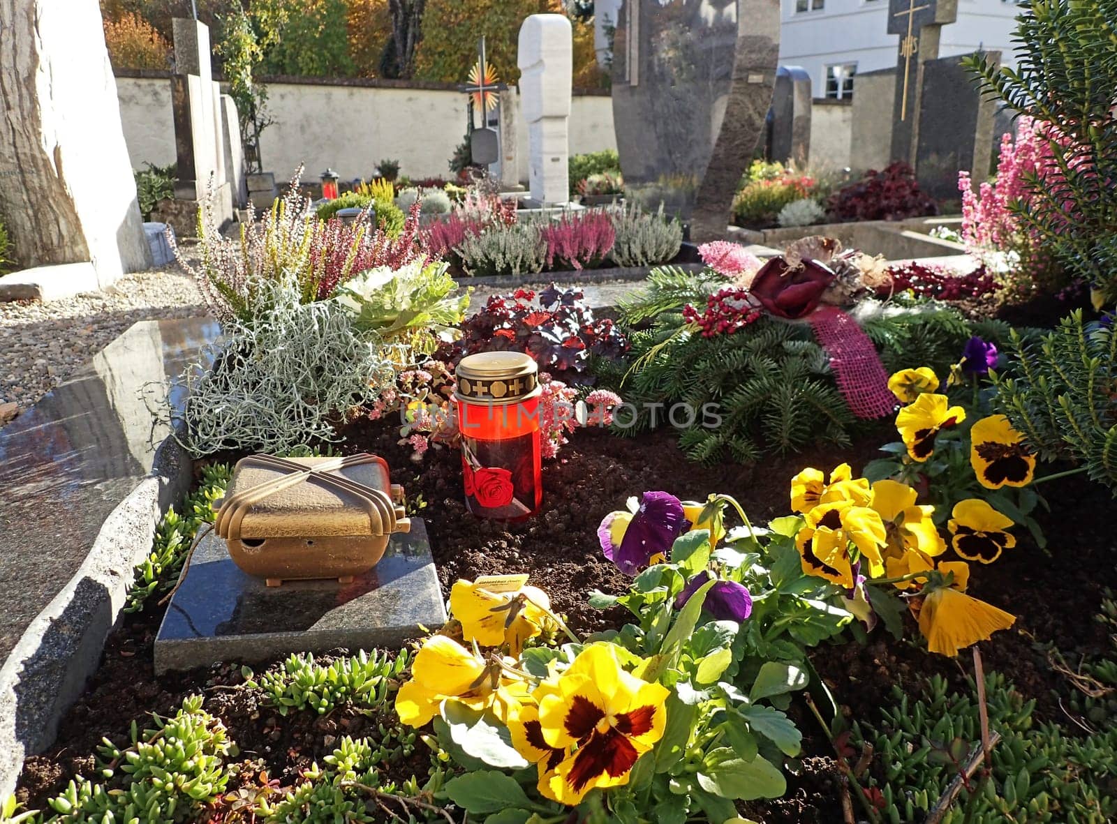 Beautifully decorated graves on a cemetery on All Saints Day in Bavaria