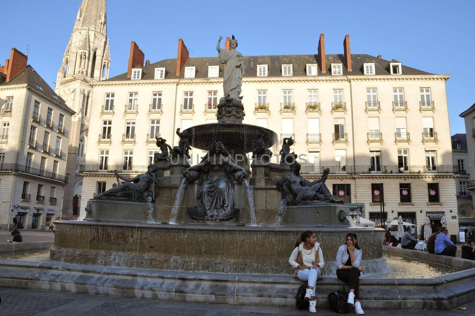 People in front of the Fountain on the Place Royale in Nantes
