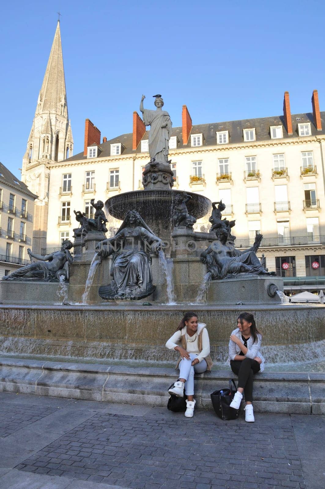 People in front of the Fountain on the Place Royale in Nantes