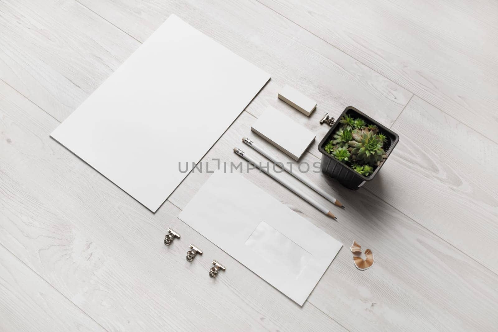 Blank corporate identity template on wooden background. Photo of blank stationery set. Mockup for design presentations and portfolios.