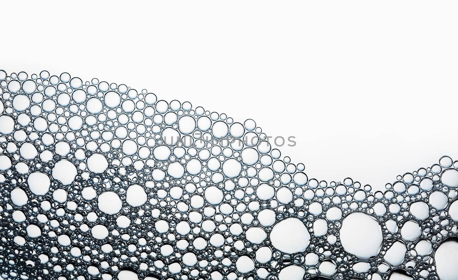 Water bubbles background. Detergent in water. Flat lay.