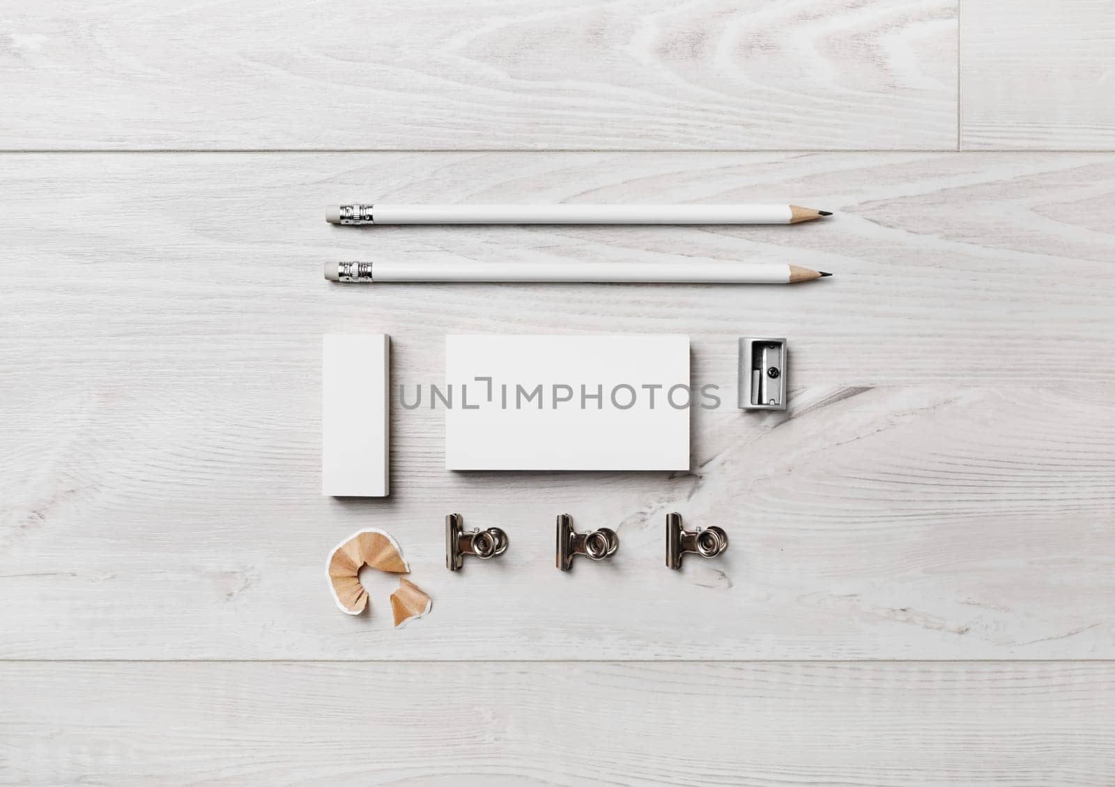 Photo of blank stationery set on wooden background. Blank stationery template for branding identity for designers. Flat lay.
