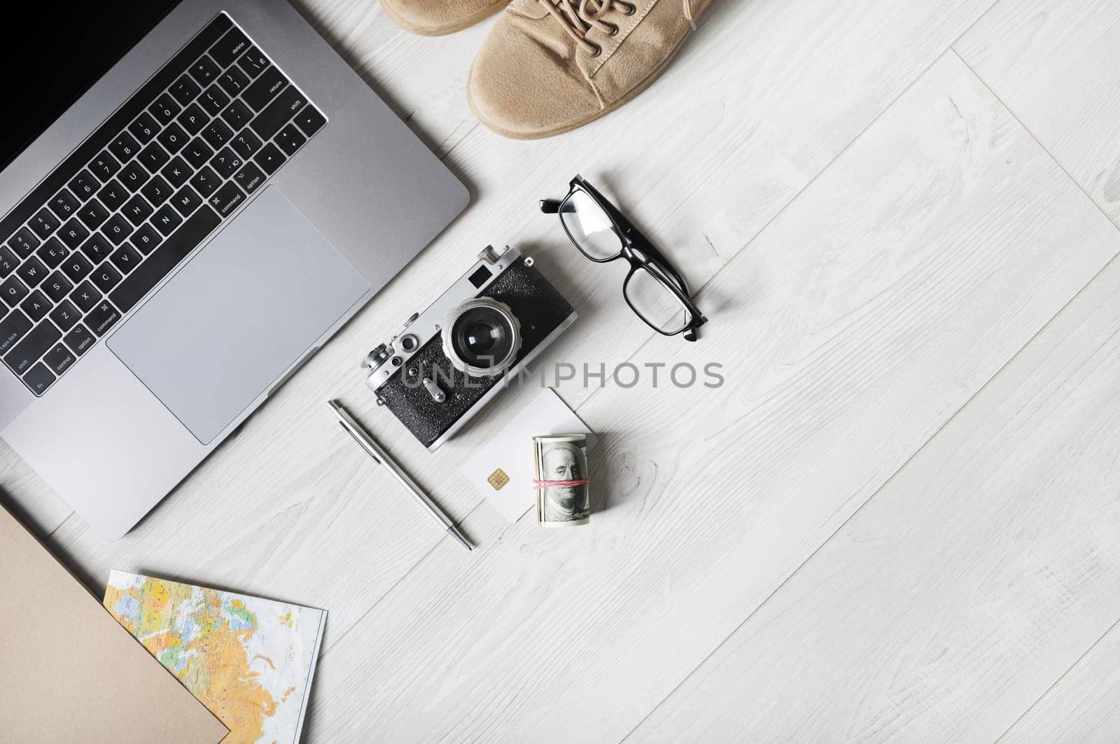 Travel supplies and laptop. Ready for trip. Copy space for your text. Flat lay.