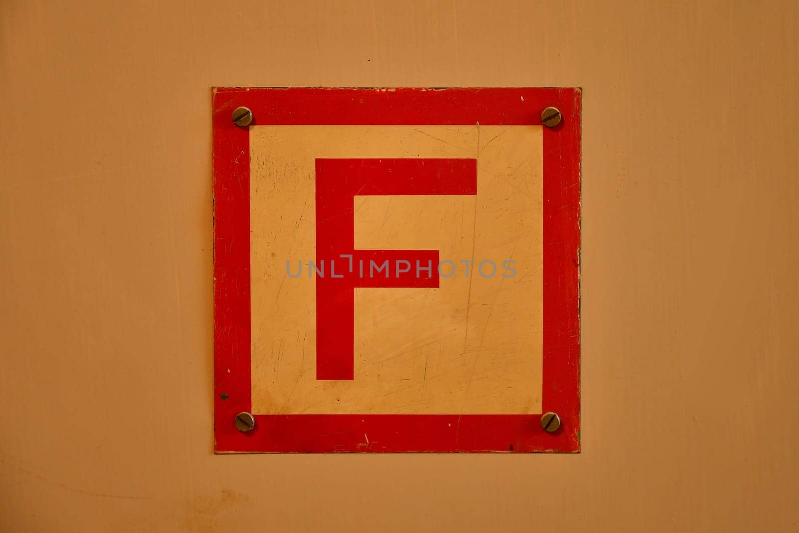 sign for a box with a fire hose in a house