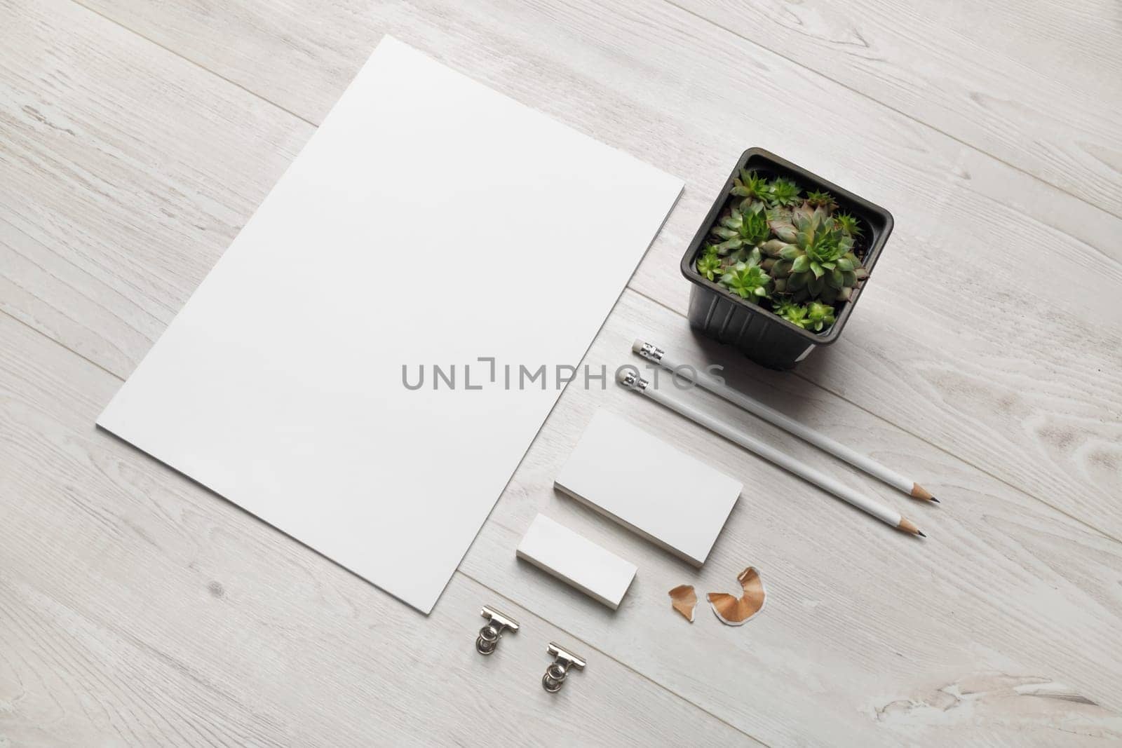 Blank business stationery set on wooden background.