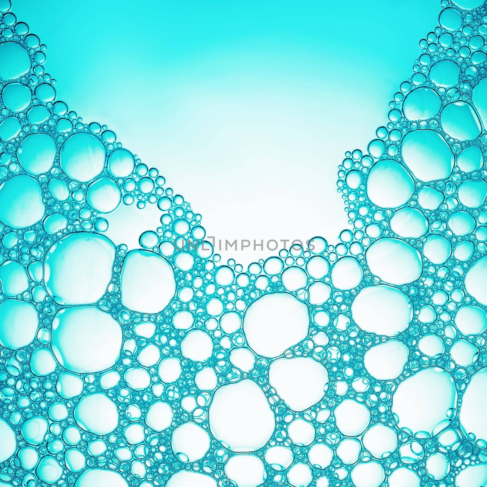 Foam with bubbles. Abstract soapy texture. Detergent in water. Flat lay.