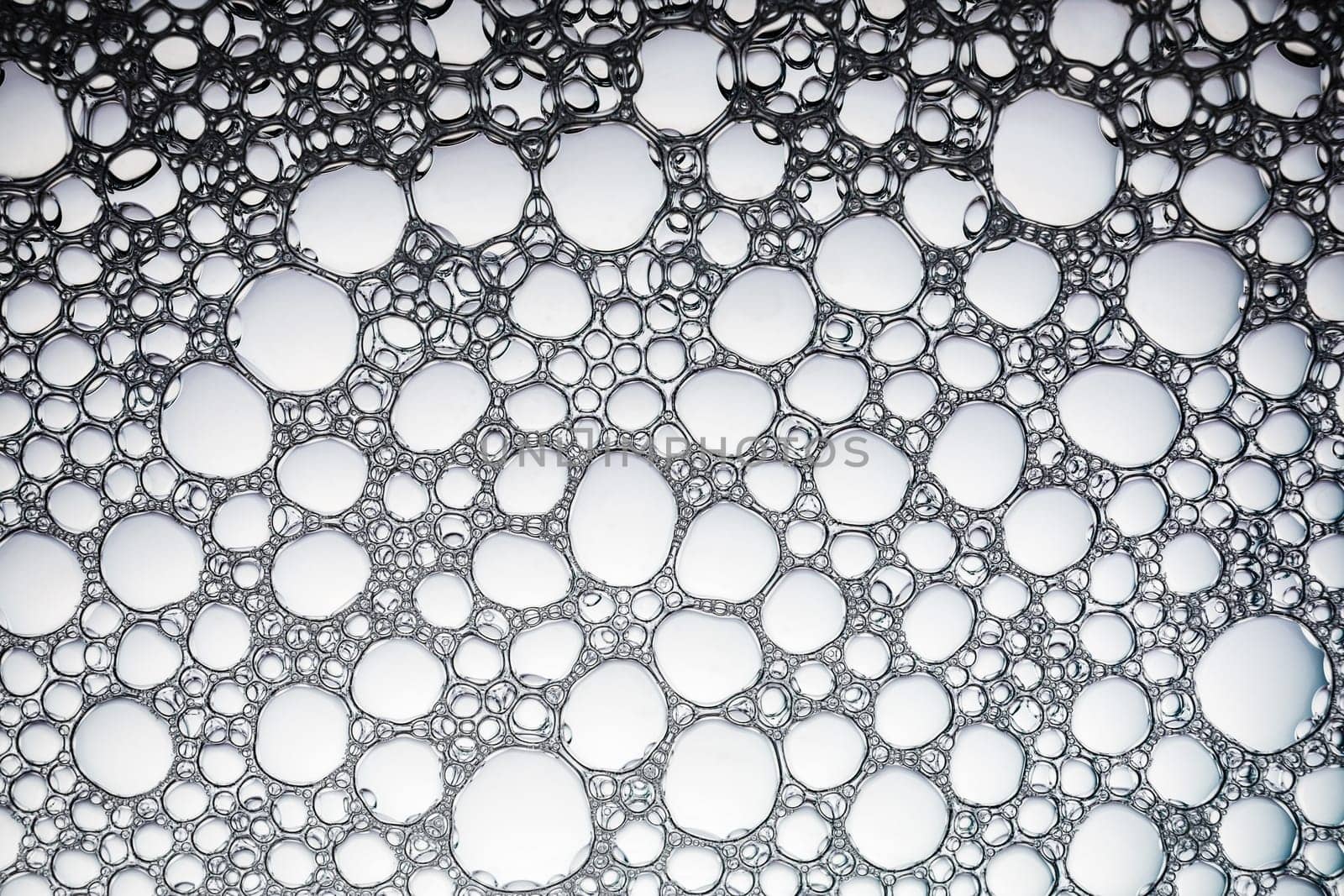 Soapsuds bubbles as background. Water background with bubbles. Flat lay.
