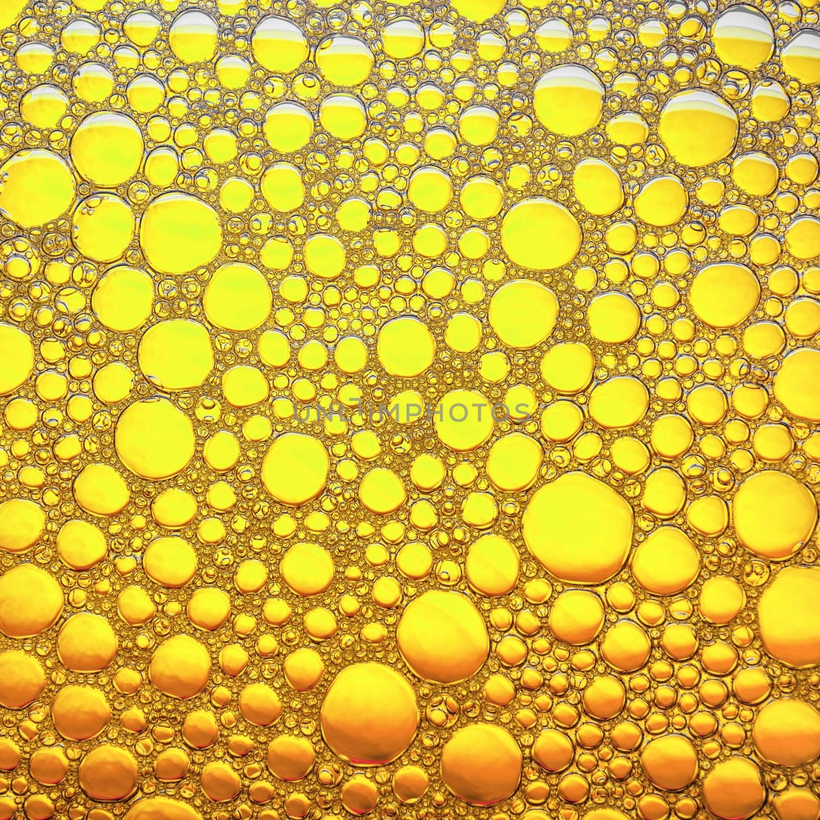 Bubbles on yellow background. Abstract bubbles texture. Flat lay.