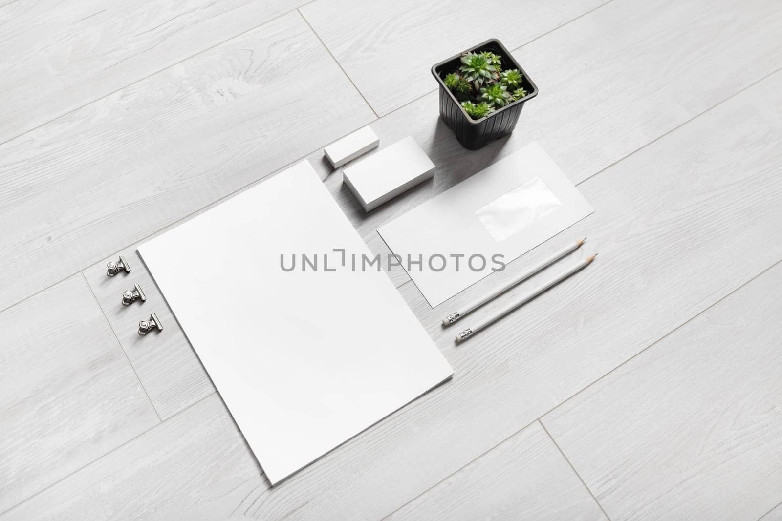 Blank branding stationery set on wooden background. Corporate identity mockup.