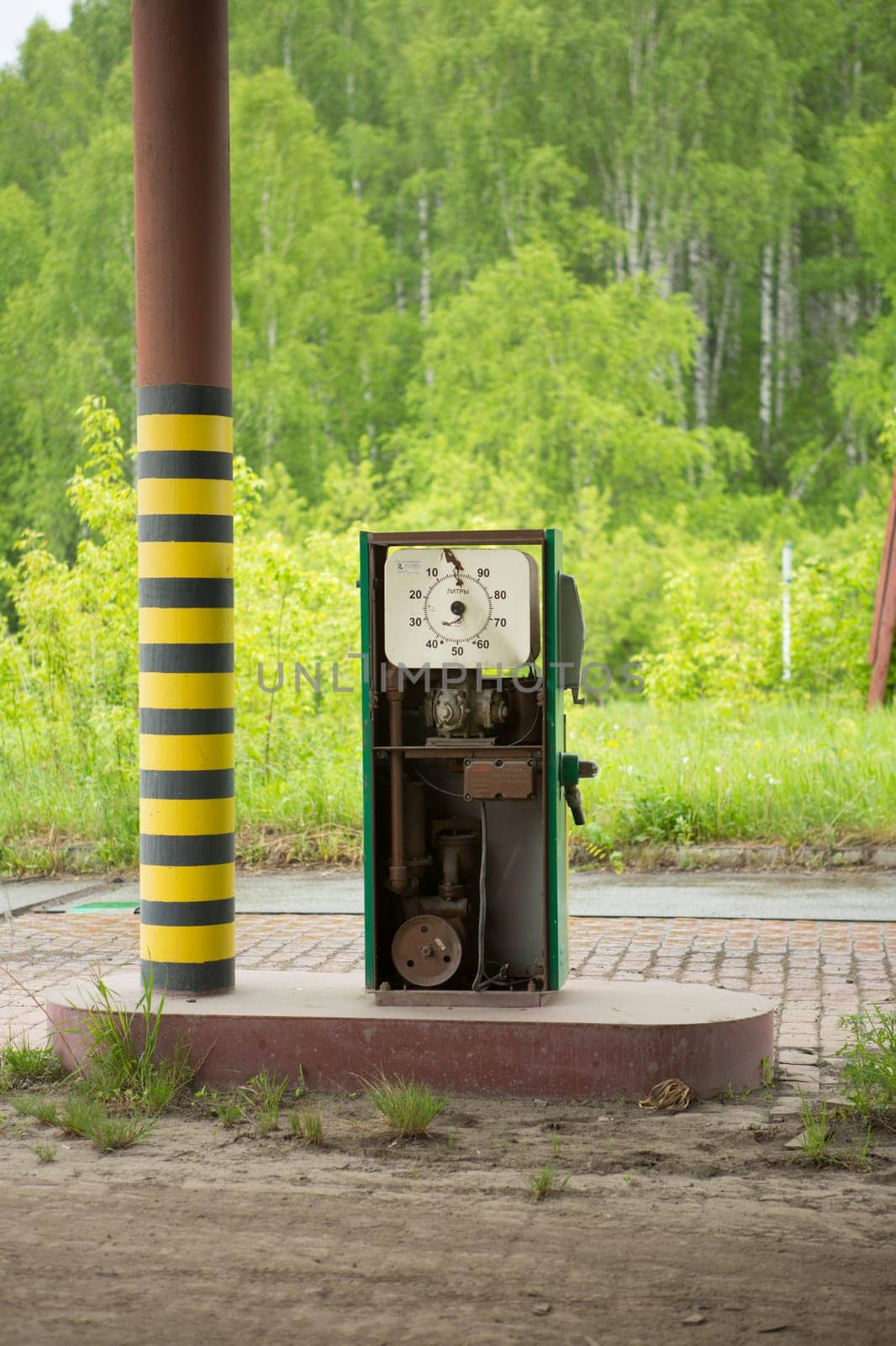 an old abandoned gas station far from the road.