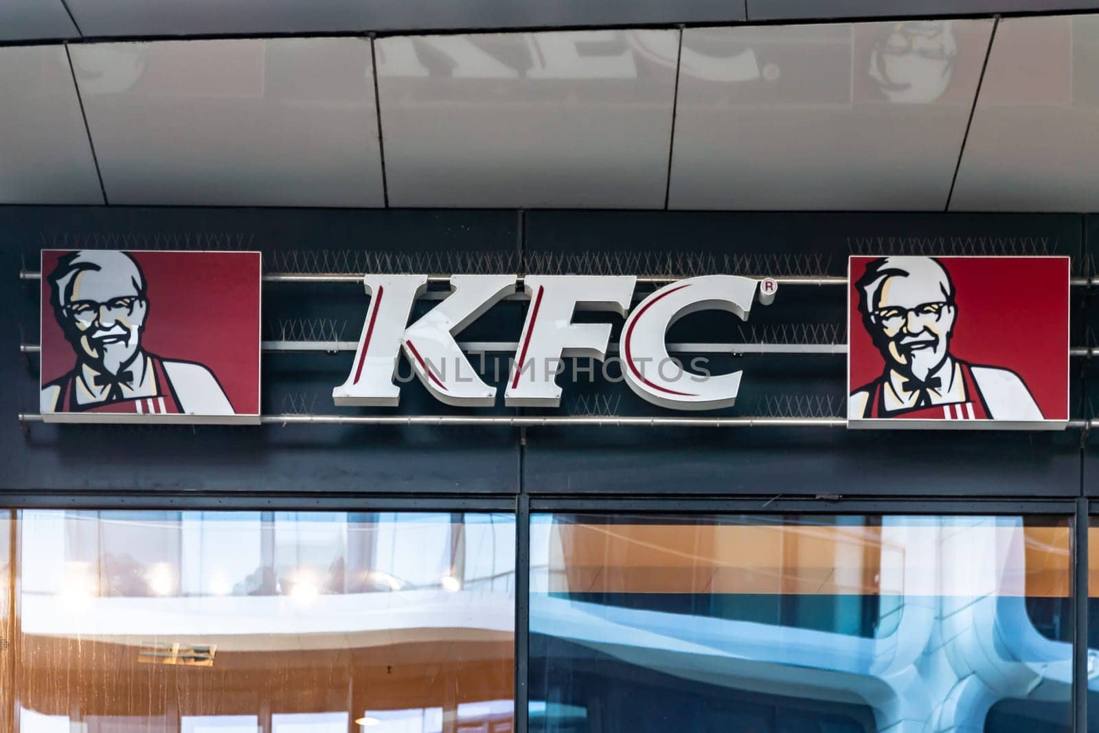 Frankfurt Main, GERMANY 09-10-2021 KFC Logo on a facade from a KFC Restaurant. Fried Chicken is an American fast food franchise system catering company.