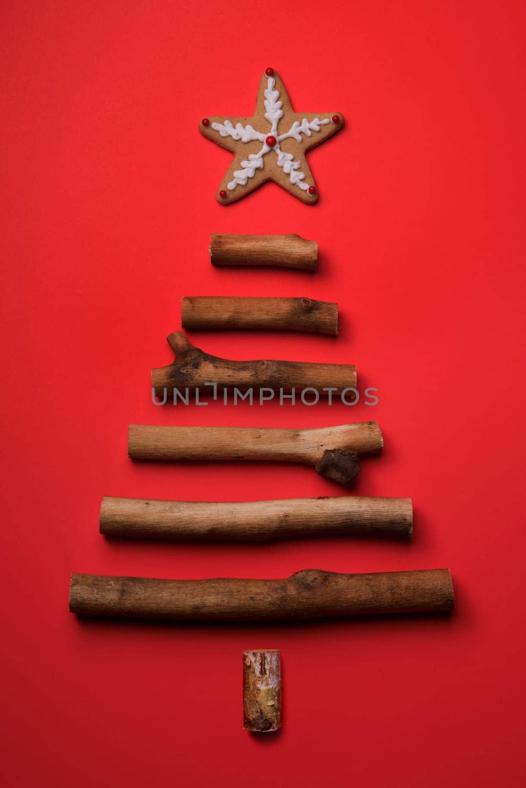 Wood Stick Christmas Tree on Red Holiday Background