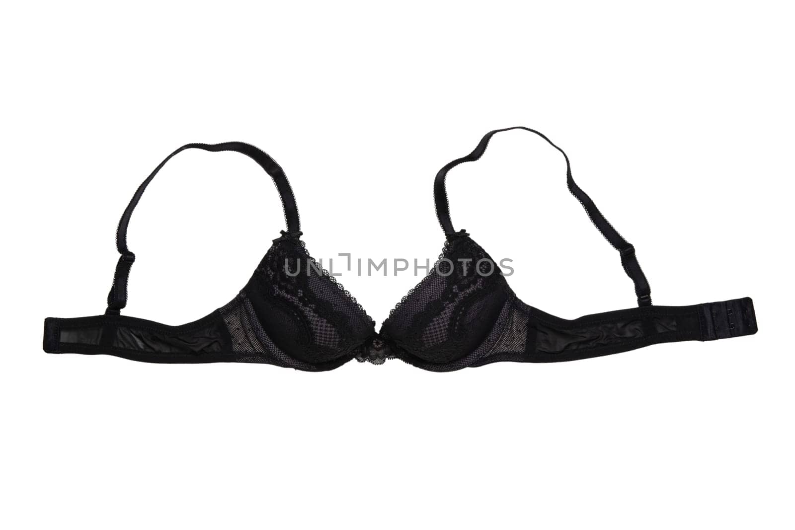 Bra isolated. Closeup of beautiful female stylish black bra with laces and straps isolated on a white background. Fashionable women underwear.