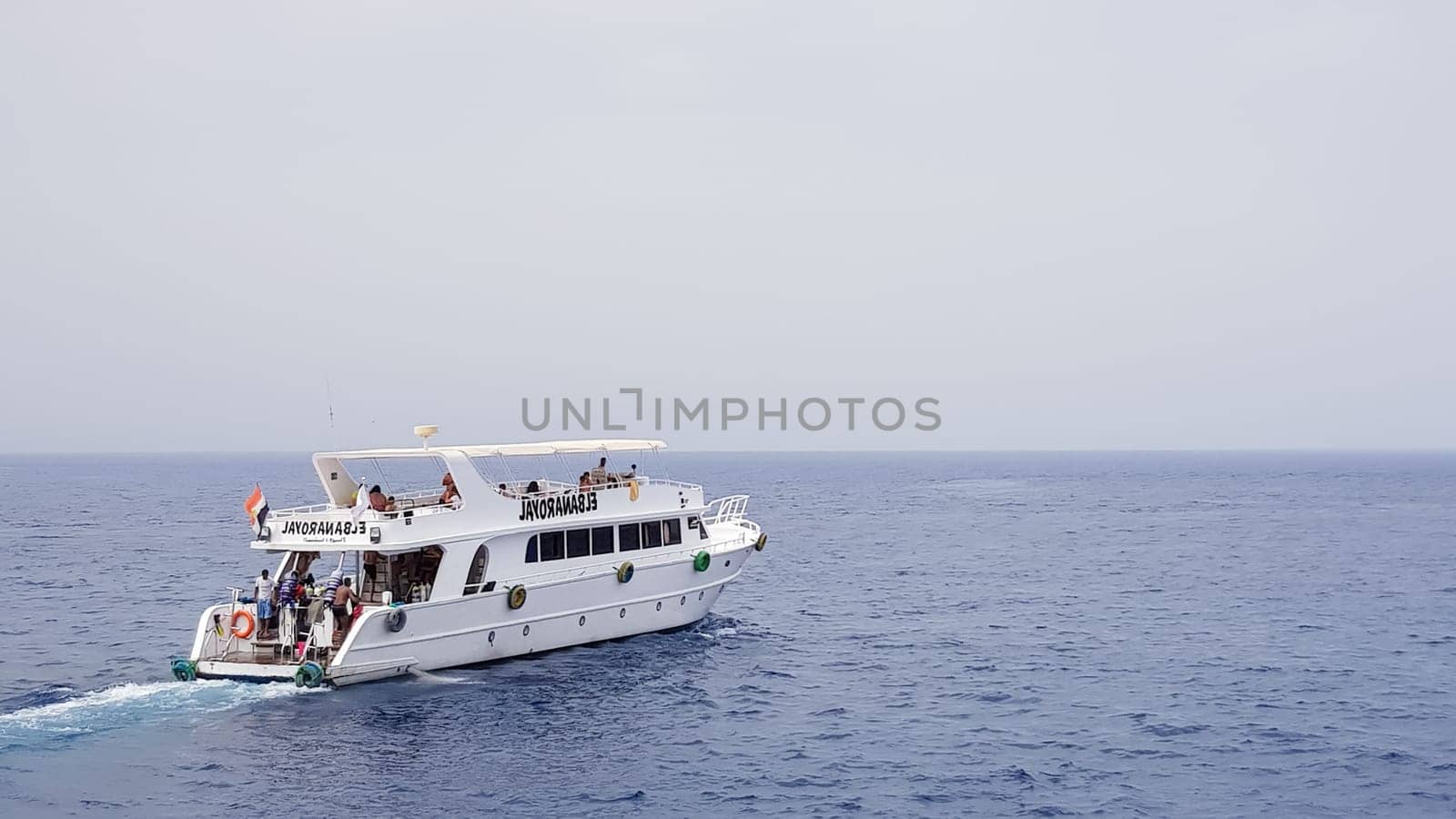 Egypt, Sharm El Sheikh - September 20, 2019: Tourist cruise boat with tourists in the Red Sea. Landscape of the Red Sea. White yachts await tourists in the azure waters of Egypt
