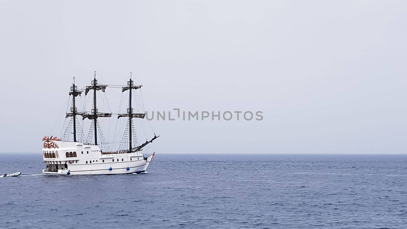 Egypt, Sharm El Sheikh - September 20, 2019: Tourist cruise boat with tourists in the Red Sea. Landscape of the Red Sea. White yachts await tourists in the azure waters of Egypt