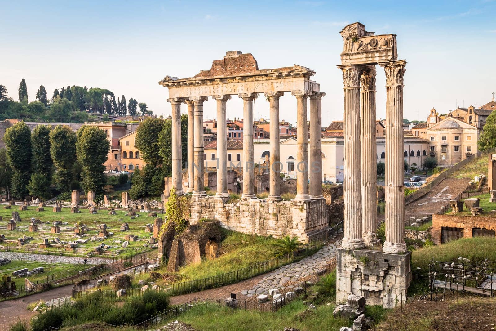 ROME, ITALY - CIRCA AUGUST 2020: sunrise light with blue sky on Roman ancient architecture.