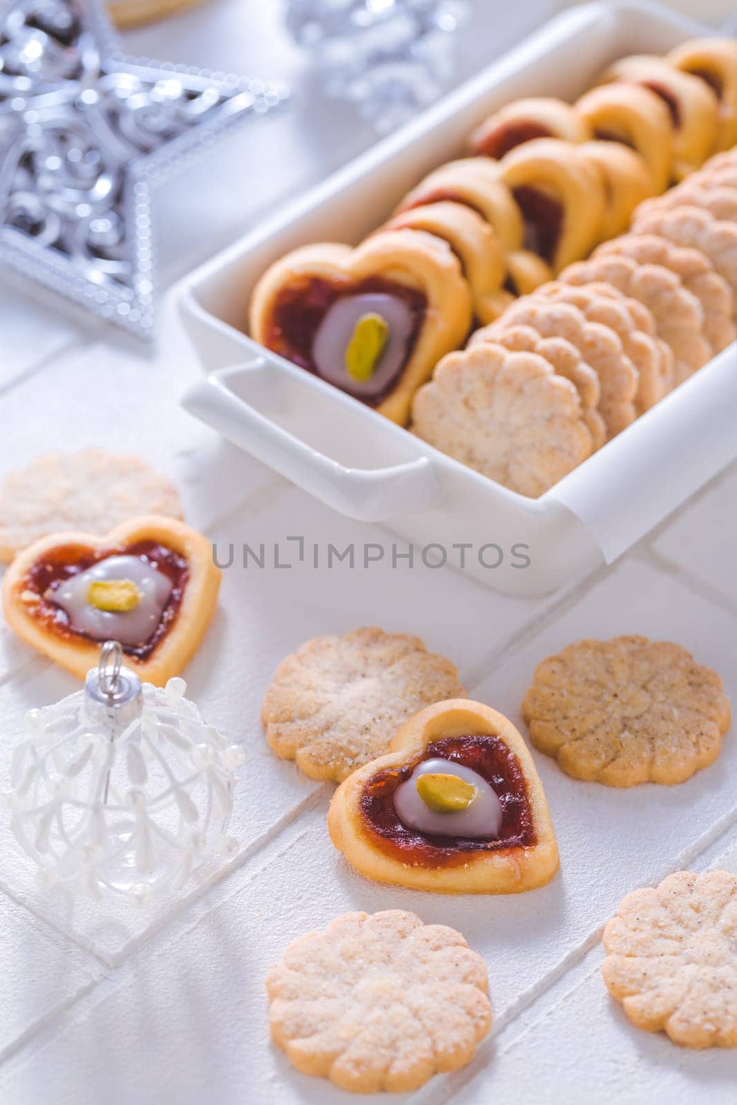 Homemade Christmas cookies with ornaments in white
