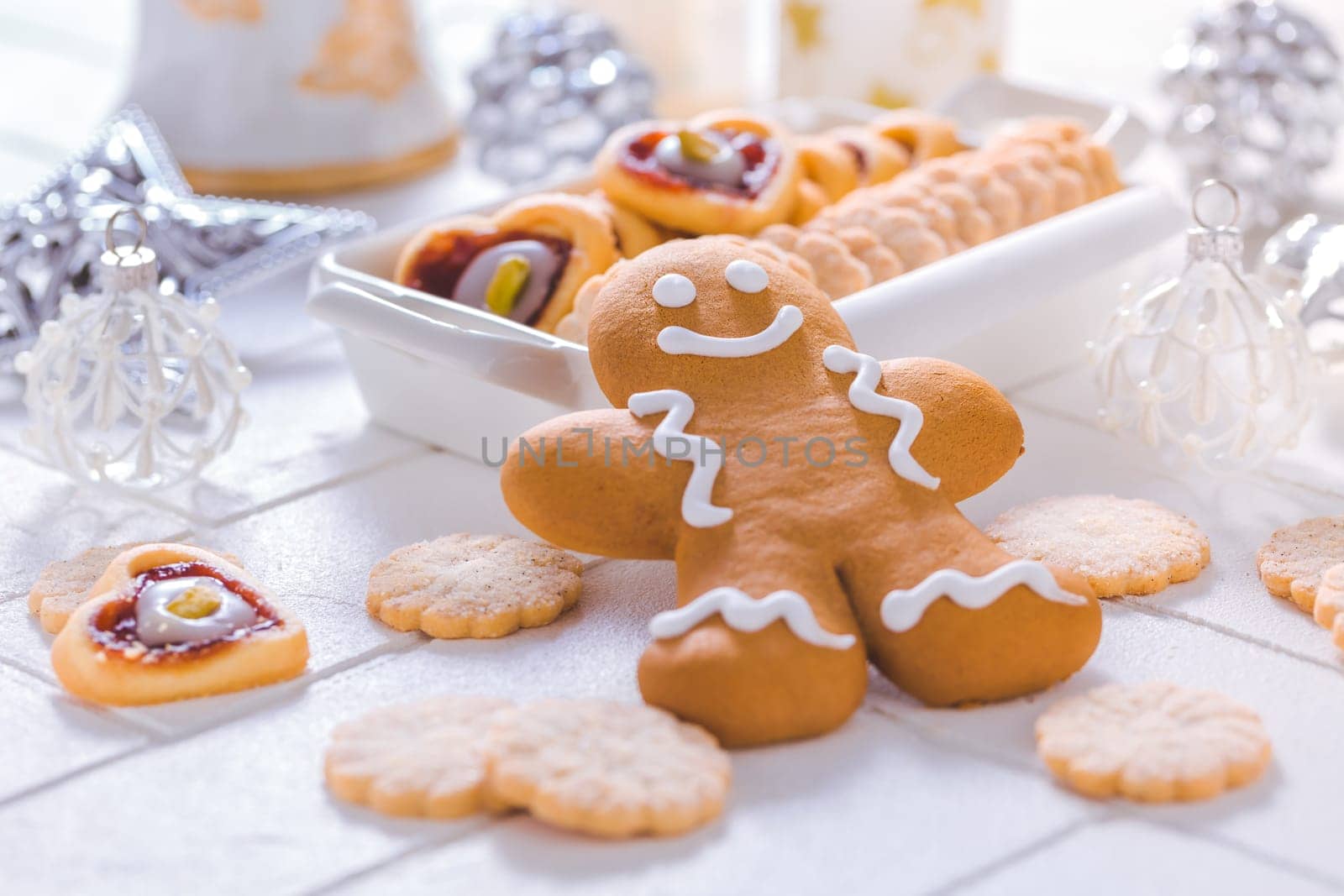 Homemade Christmas cookies and gingerbread with ornaments in white