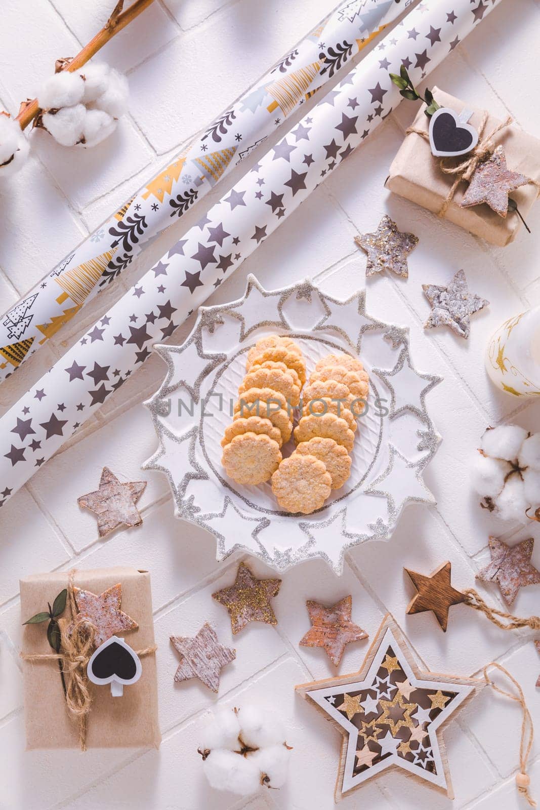 Christmas time, homemade cookies with ornaments and winter decorations in white
