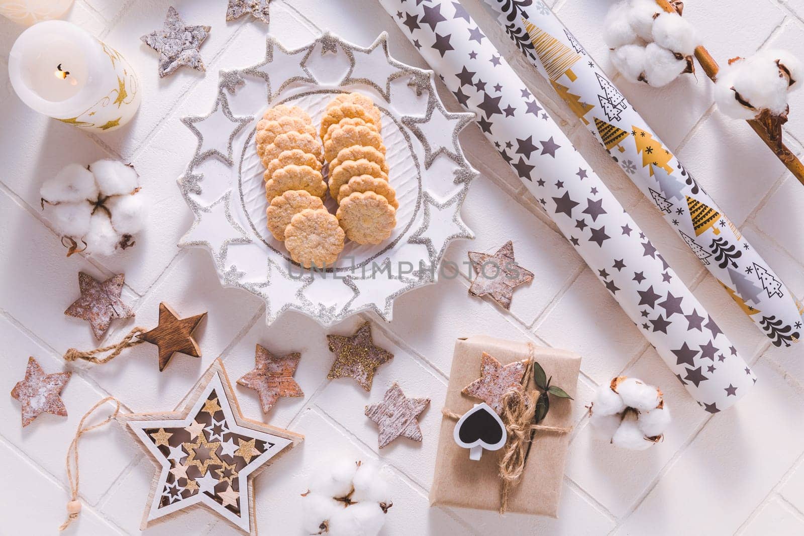 Christmas time, homemade cookies with ornaments and winter decorations in white