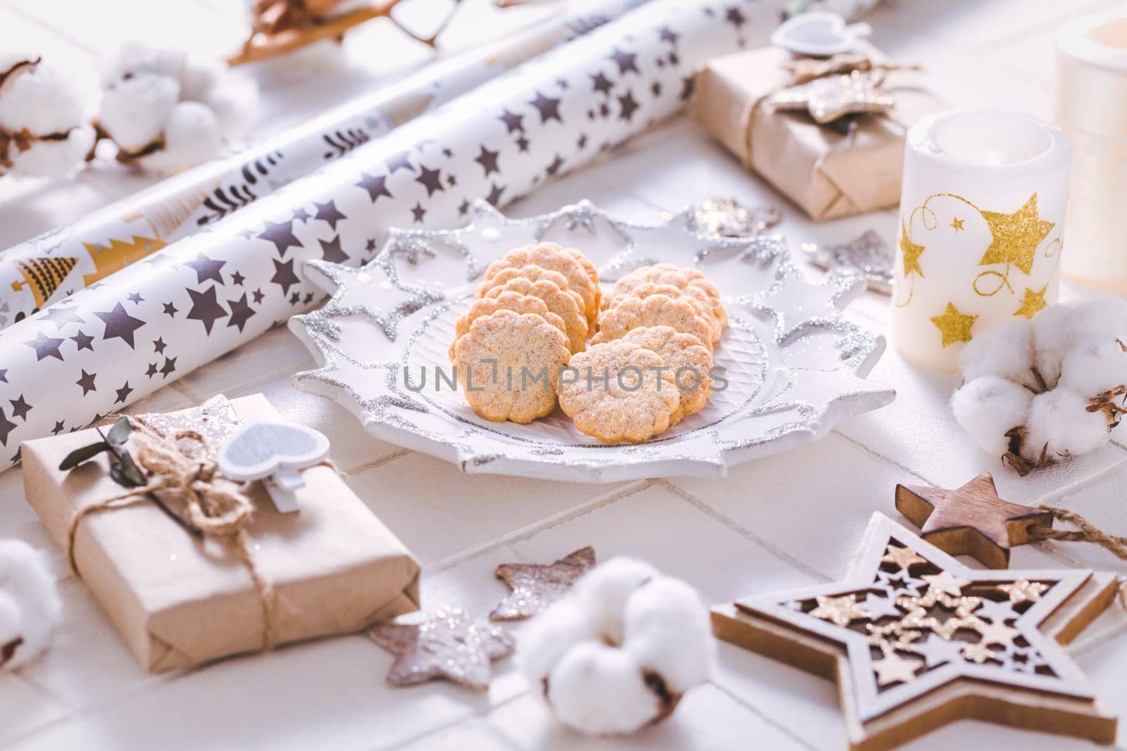 Christmas time, homemade cookies with ornaments and winter decorations in white