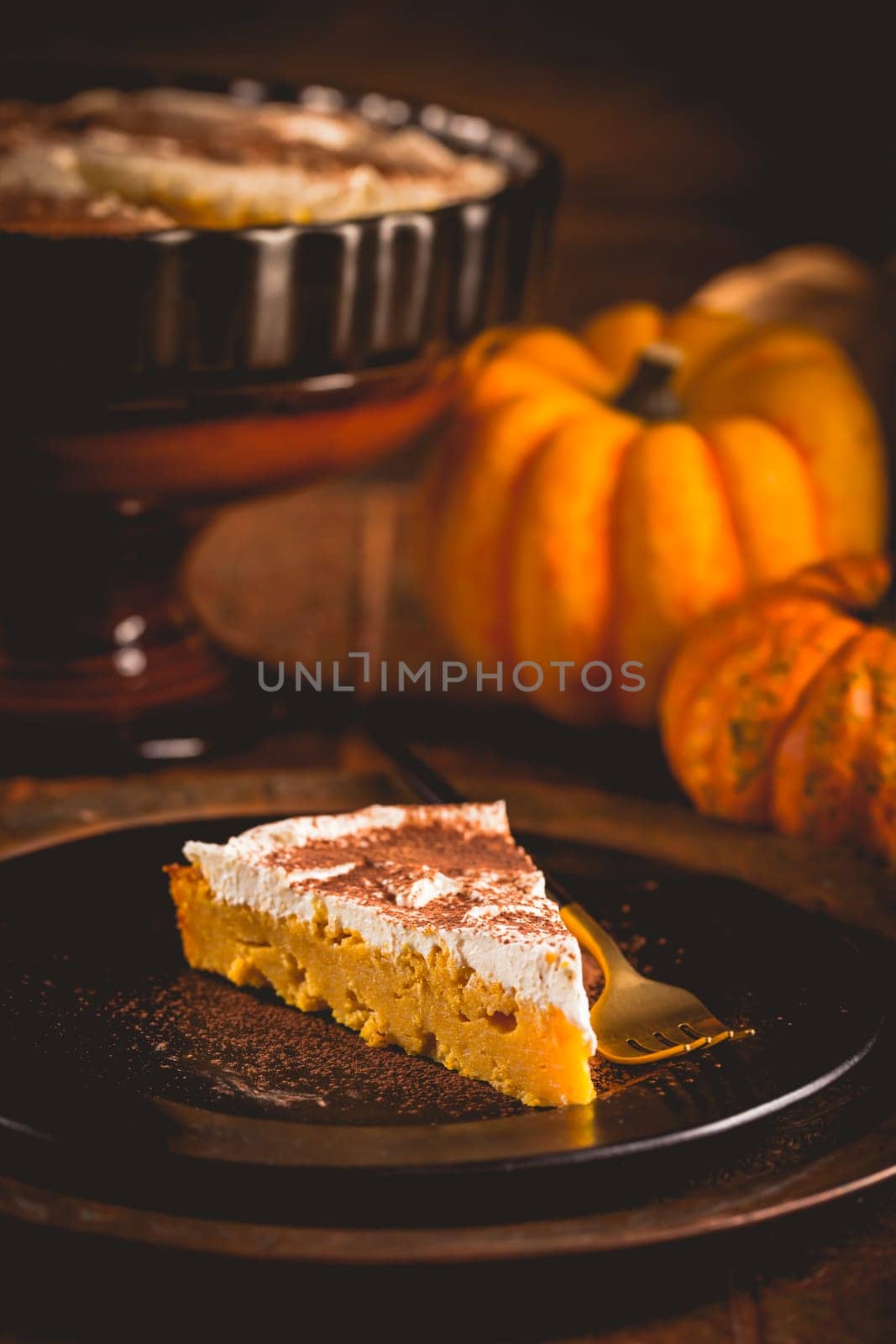 Homemade pumpkin pie with icing for Thanksgiving