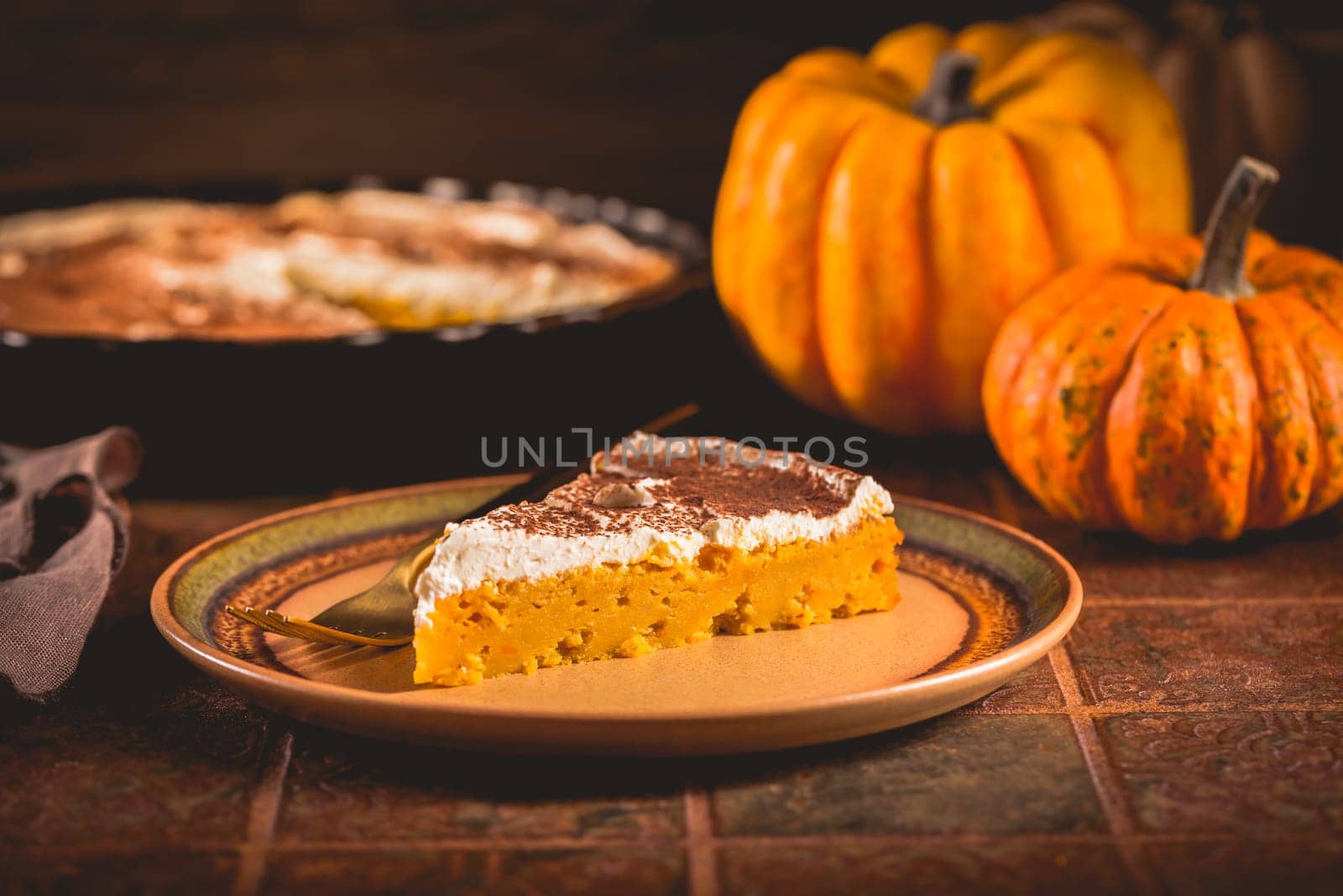 Homemade pumpkin pie with icing for Thanksgiving