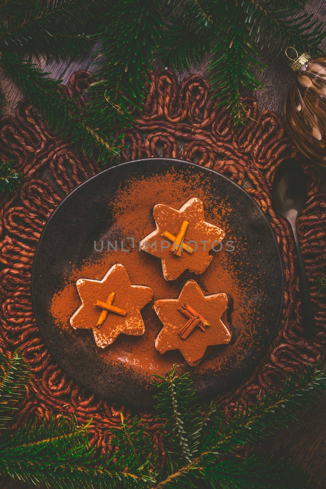 Christmas cinnamon ice dessert in star shape with ornaments