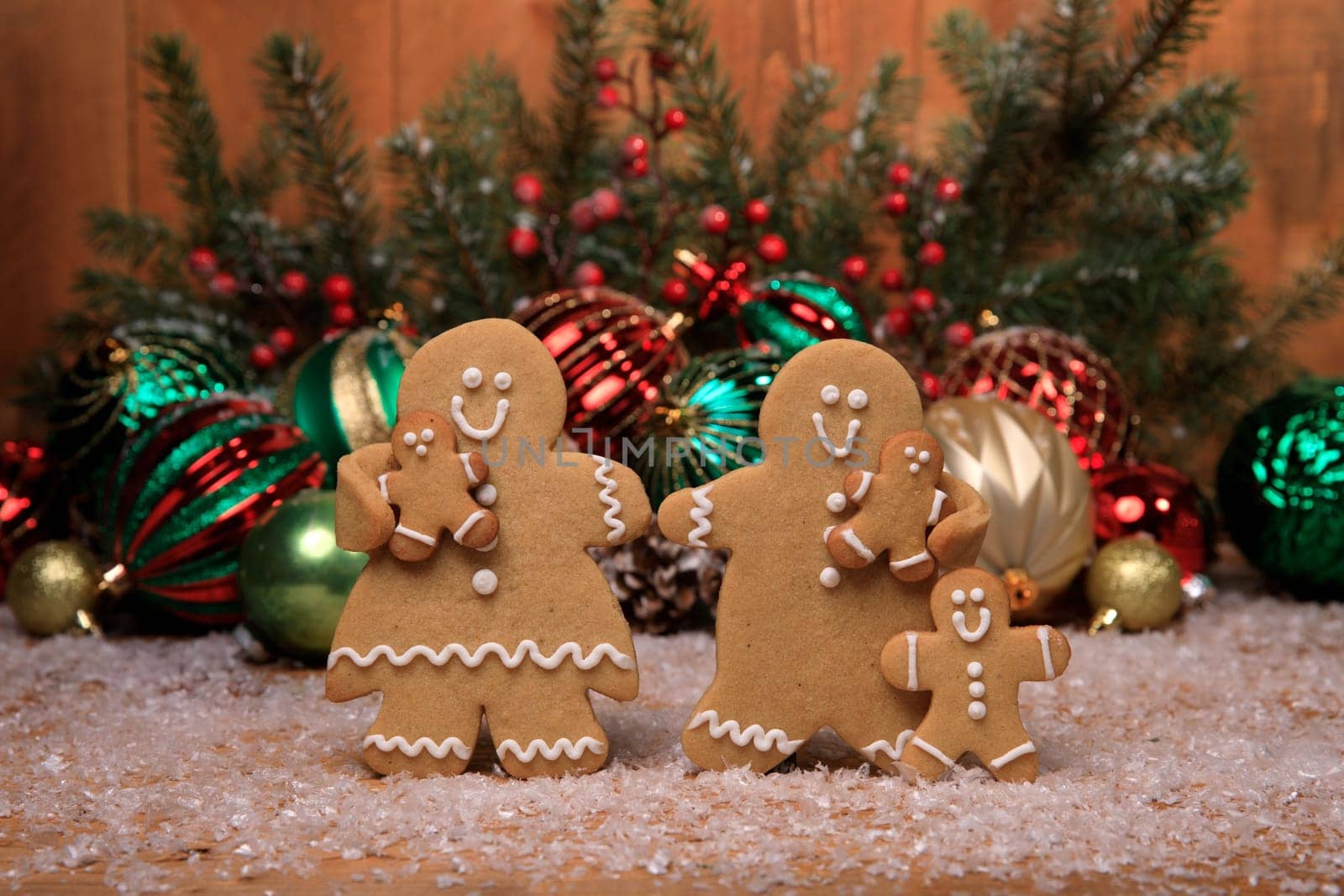 Gingerbread Family of 3 kids on Holiday Christmas Background