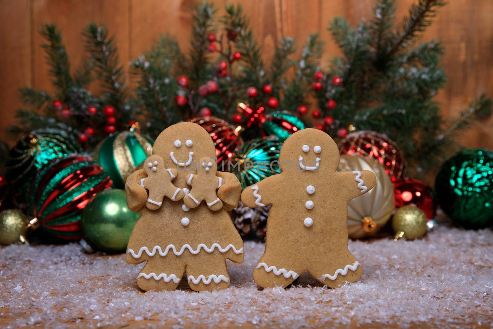 Gingerbread Family of 2 kids on Holiday Christmas Background
