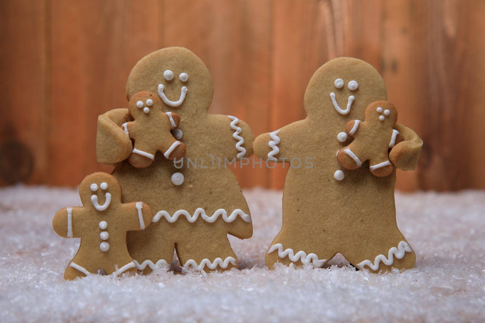 Gingerbread Family of 3 kids on Holiday Christmas Background