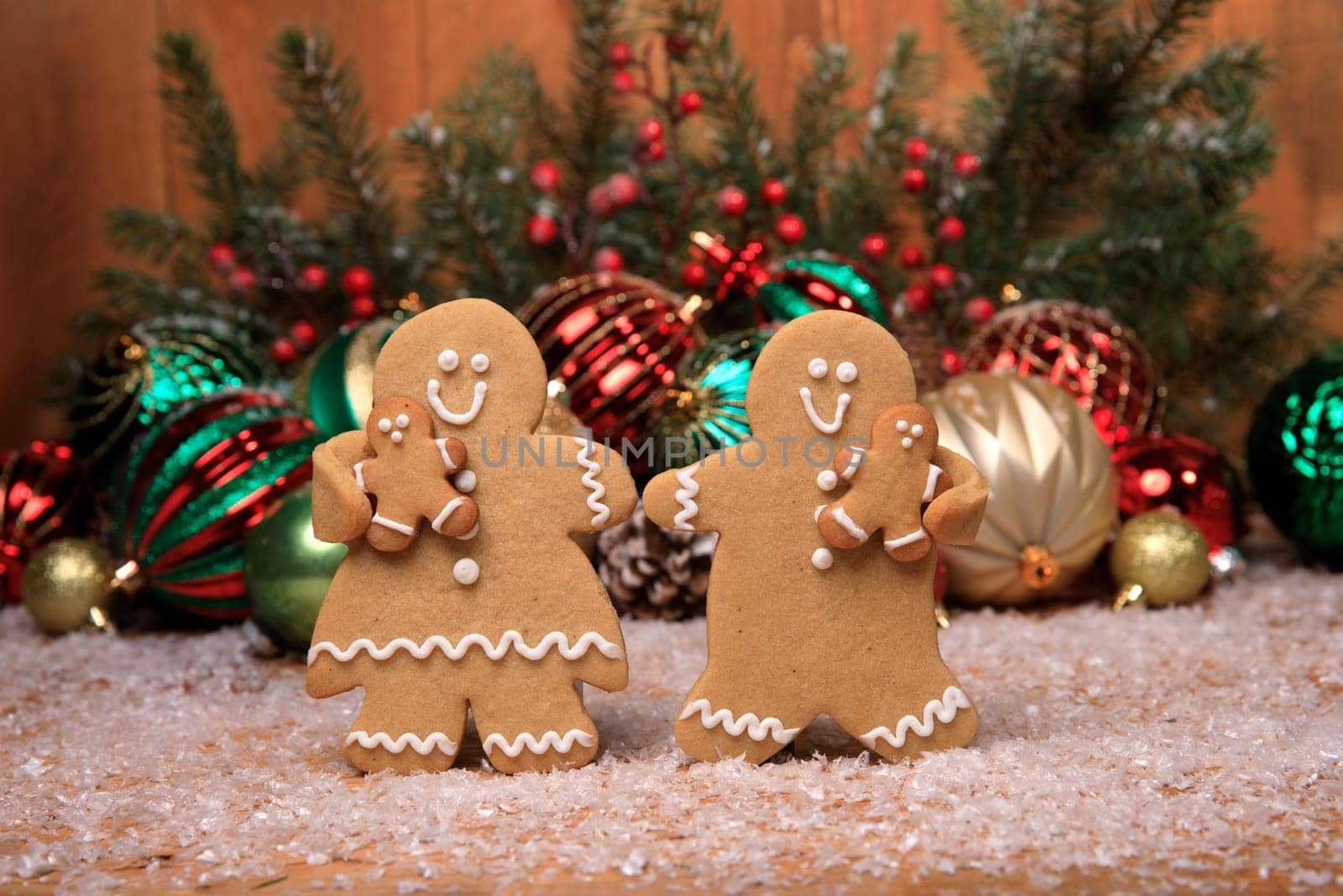 Gingerbread Family of 2 kids on Holiday Christmas Background