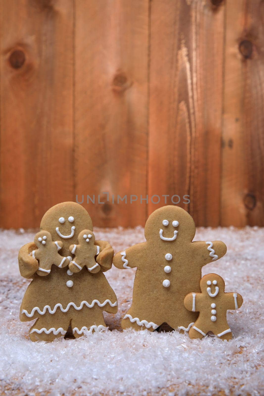 Gingerbread Family of 3 kids on Holiday Christmas Background