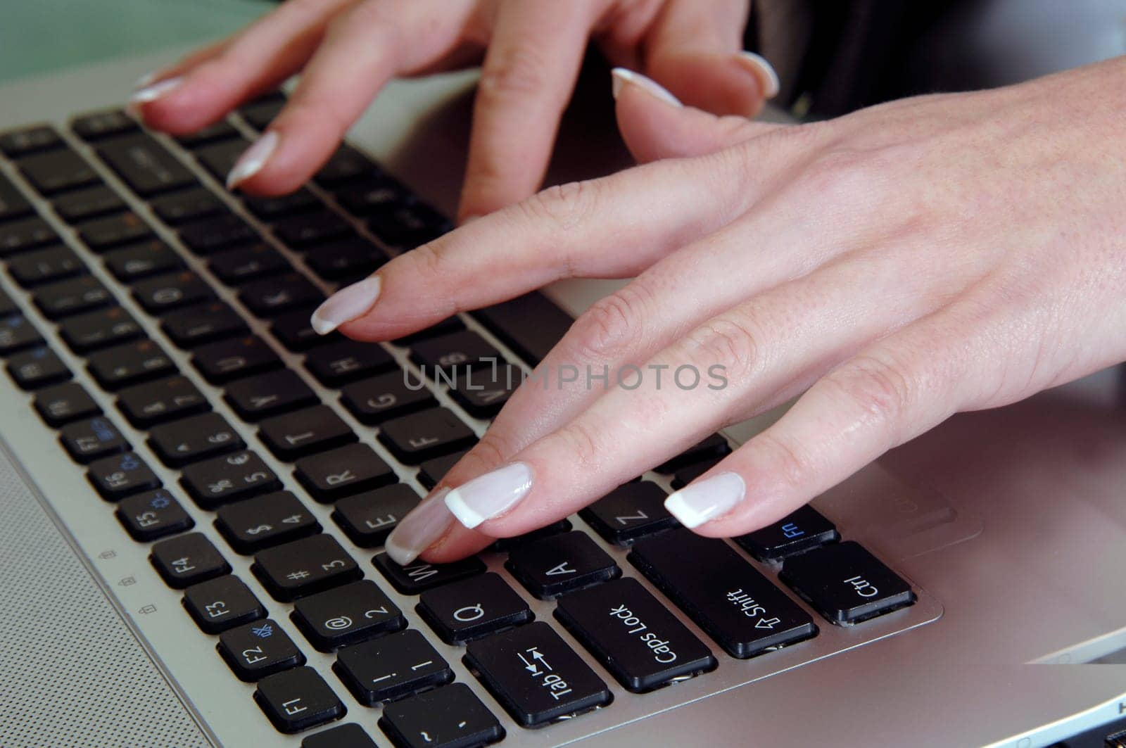 the woman is typing on the computer