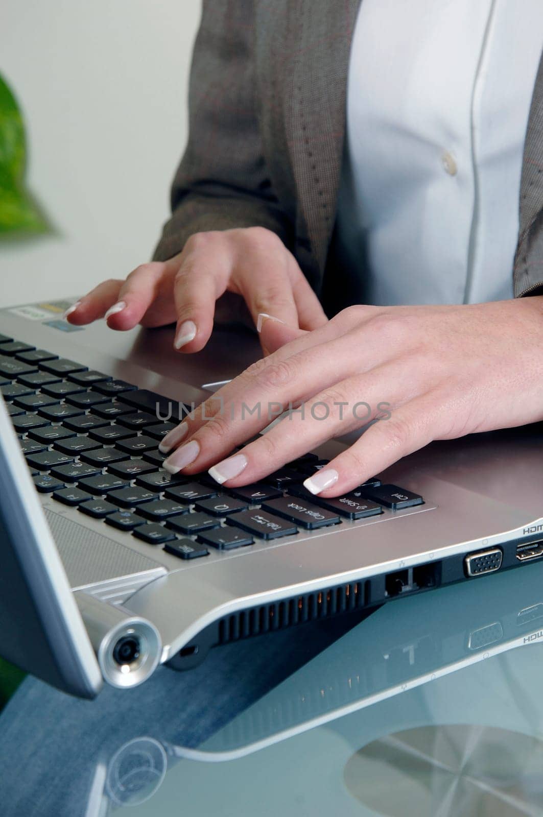 the woman is typing on the computer