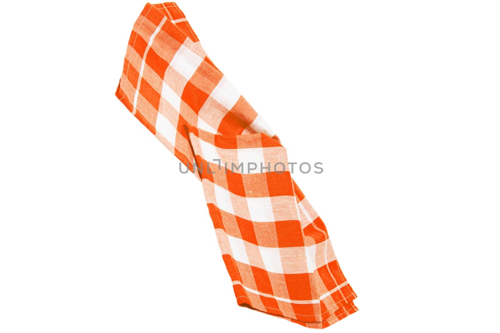 Closeup of a orange and white checkered napkin or tablecloth texture isolated on a white background. Kitchen accessories.