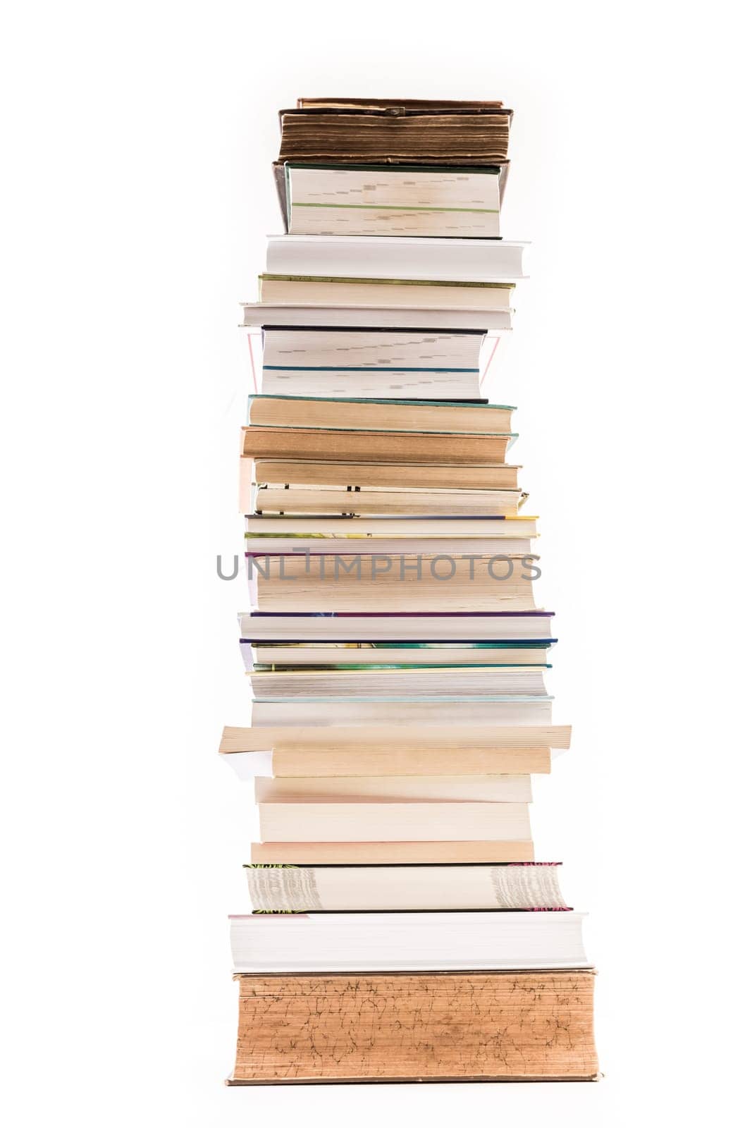 Pile of old and new books isolated on white background