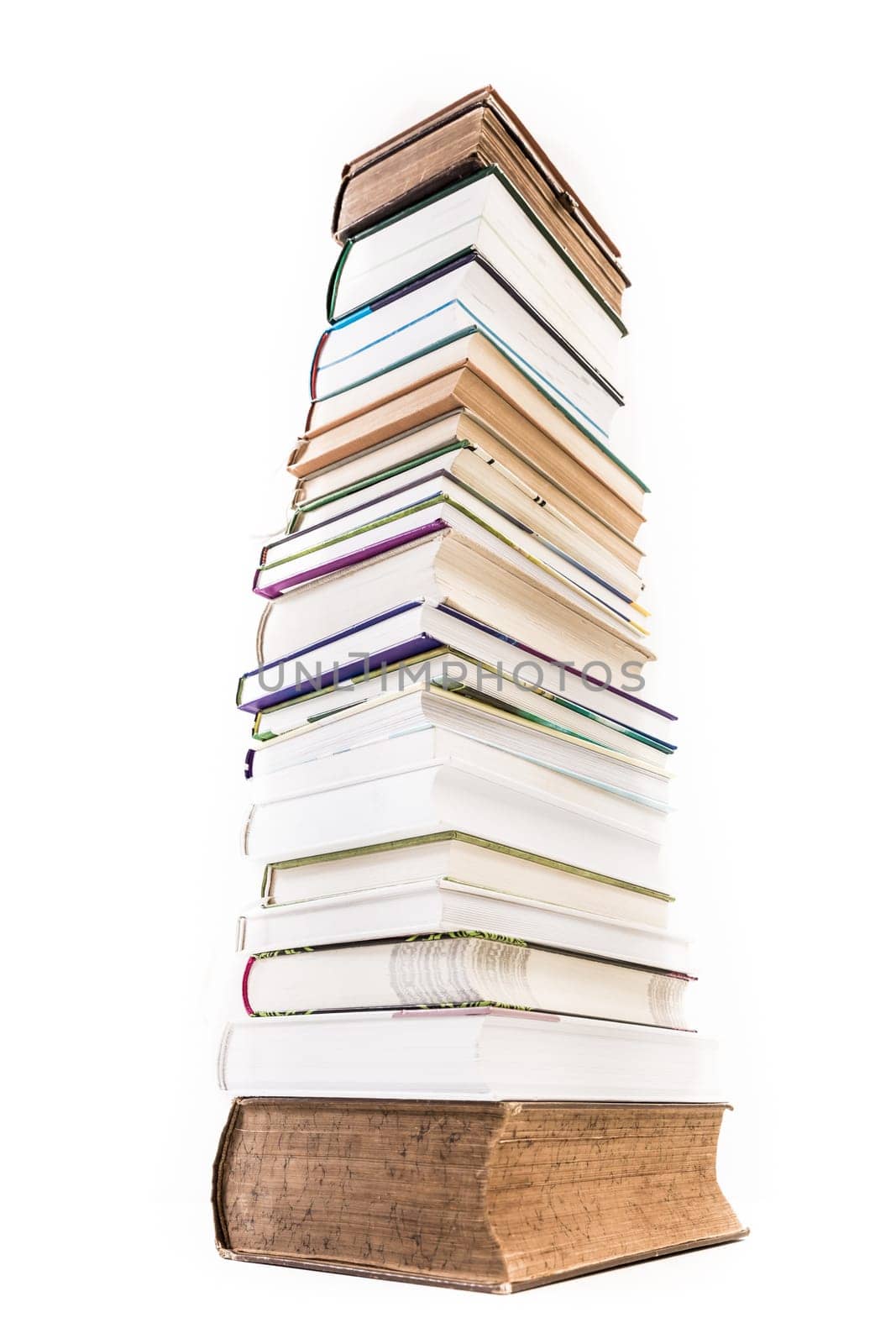 Pile of old and new books isolated on white background